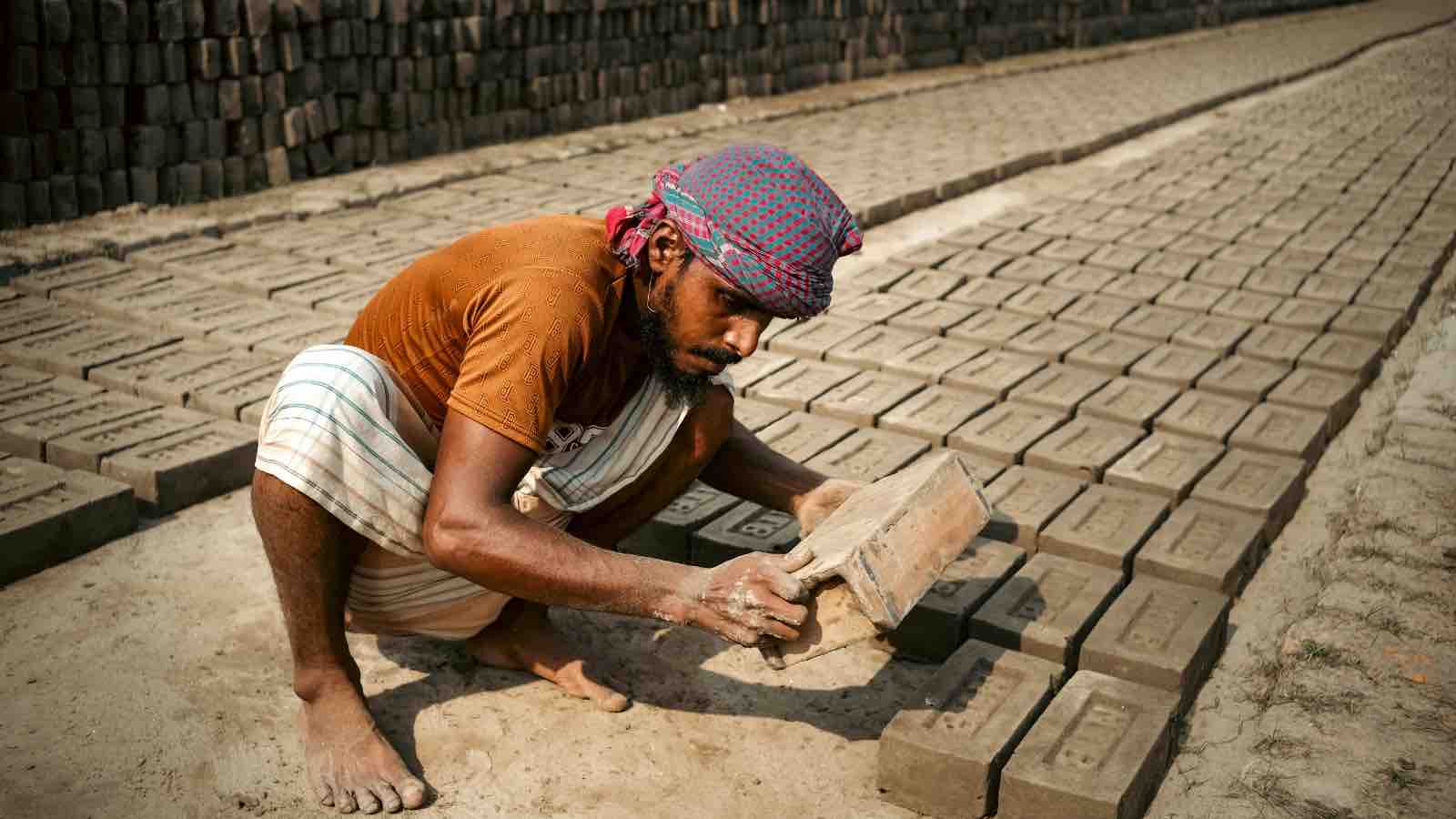 outdoor worker | Bricklayer Arranging Freshly Molded Bricks Outdoors by Azraf Mohammod Nakib from Pexels