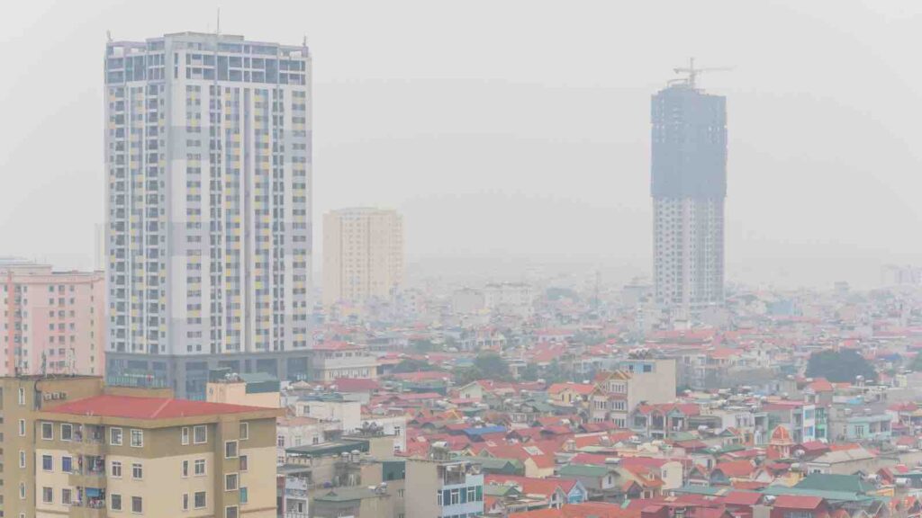 Top view foggy and misty Hanoi urban landscape causes by air pollution by TrongNguyen from Getty Images