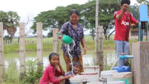 image : ADB (Villagers in Phnom Dey commune of Cambodia’s Banteay Meanchey province accessing water from a well rehabilitated through ADB support.)