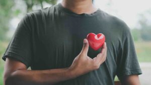 Hand holding red heart, Health care and mental health by LAONG from LAONG